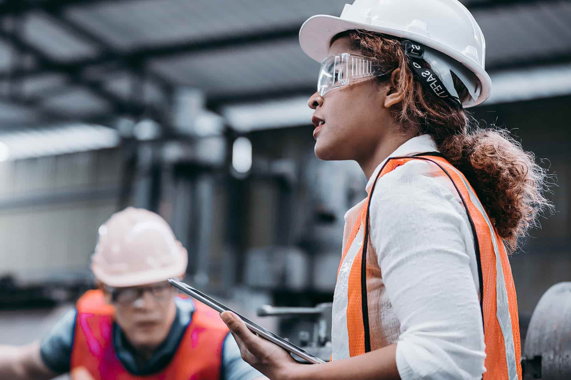 Student working on the field. A woman wearing safety gear on-site working in the field as a MEML Student