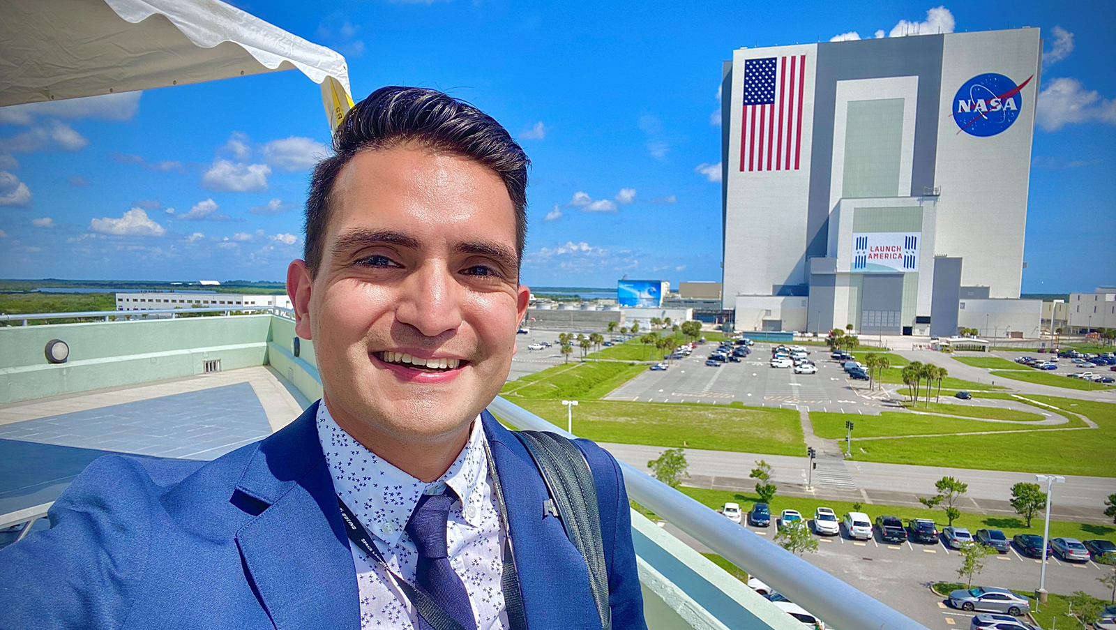 Juan “Tony” Castilleja standing in front of NASA building