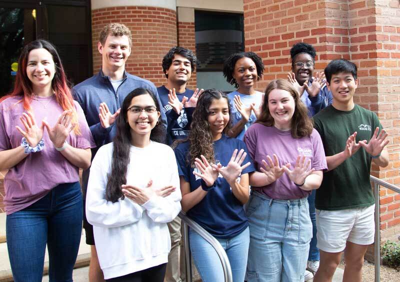 Group of students holding signs