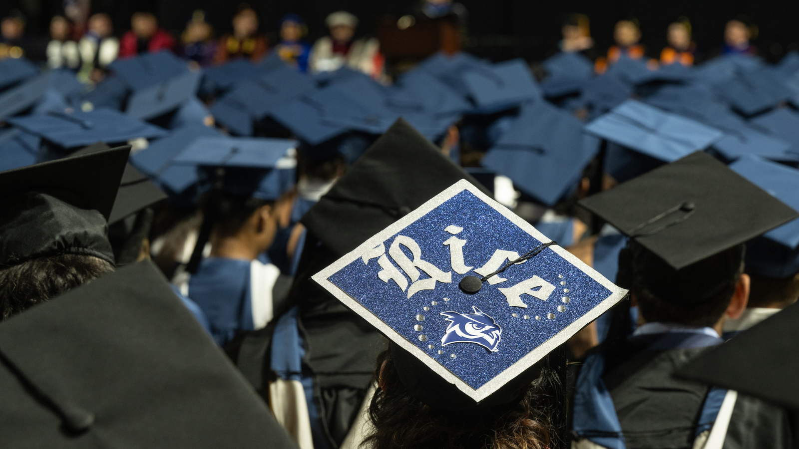 graduation cap with Rice "R"