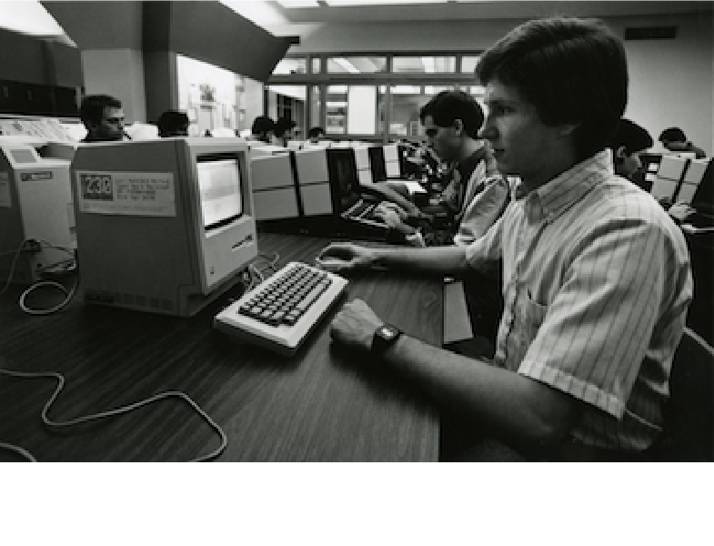 Student working on 1984 Macintosh computer