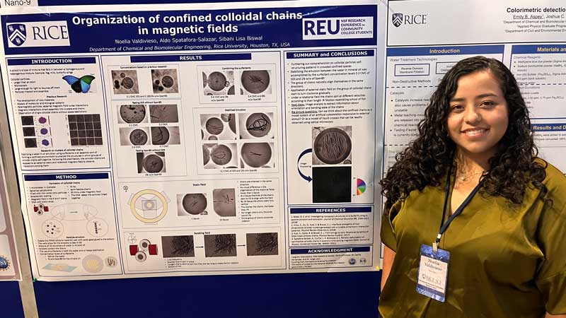 Noelia Valdivieso standing in front of research poster