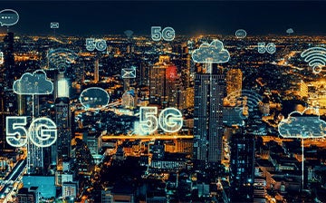 graphic of 5g network clouds over a city at night