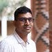 Professional headshot of Dr. Barun Mahata in a button-down shirt in front of a brick background on Rice University campus